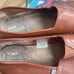 Men’s Tom’s leather slip ons.