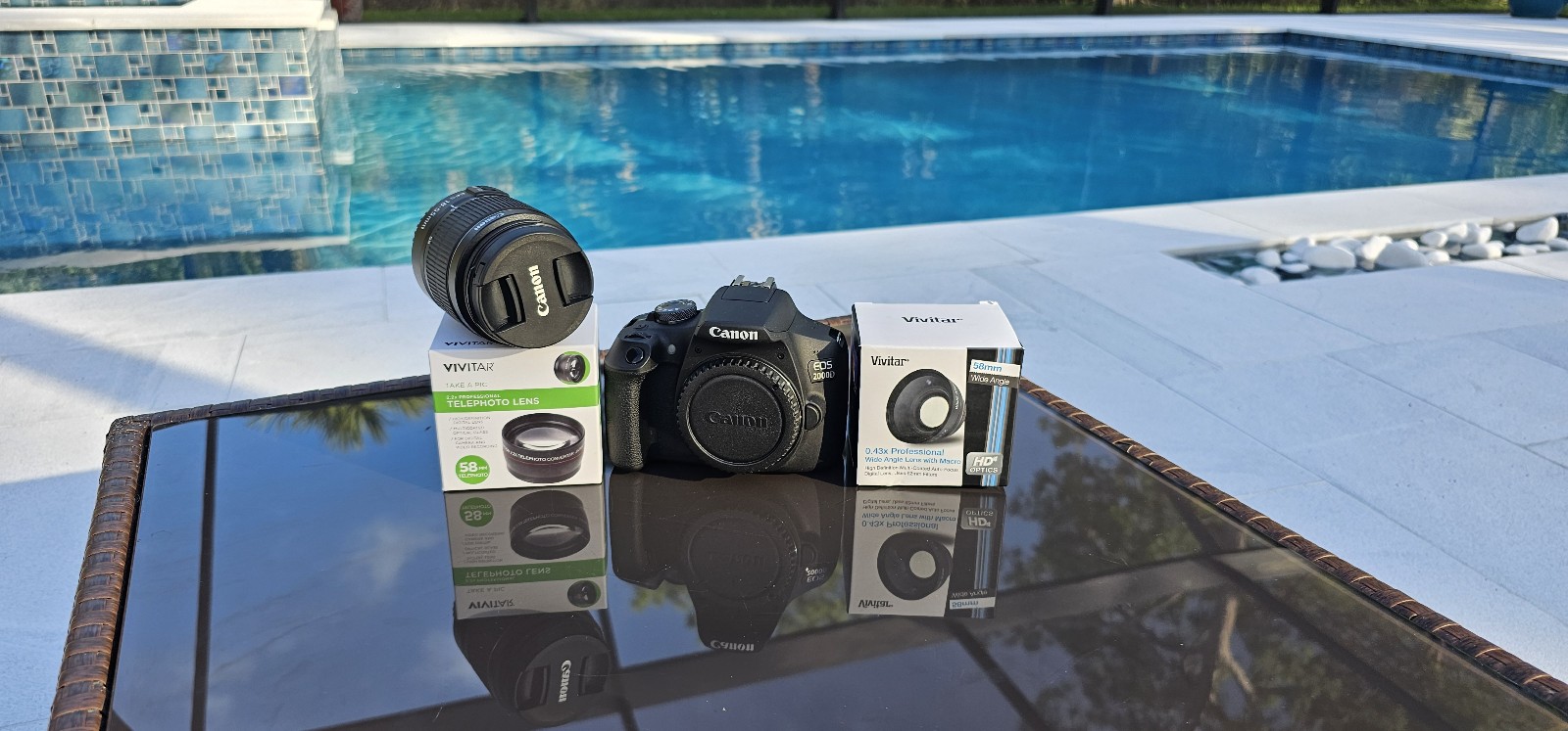 Canon EOS 2000D kit with a telephoto, wide-angle with macro, and an 18-55mm lens