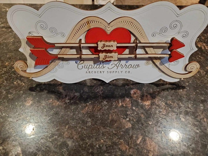 Customized Cupid Bow and Arrow Decor includes handmade easel/stand