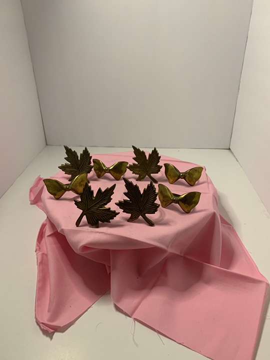 vintage medal napkin rings set of 8 leaves and bows. Heavy