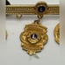 10k gold filled District Chairman Lions lapel pin with charms 1996-97