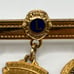 10k gold filled District Chairman Lions lapel pin with charms 1996-97