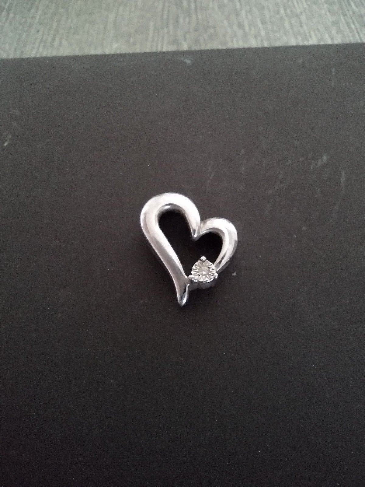 Real silver charm with tiny diamond chip