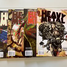Four back issues of Heavy Metal magazine