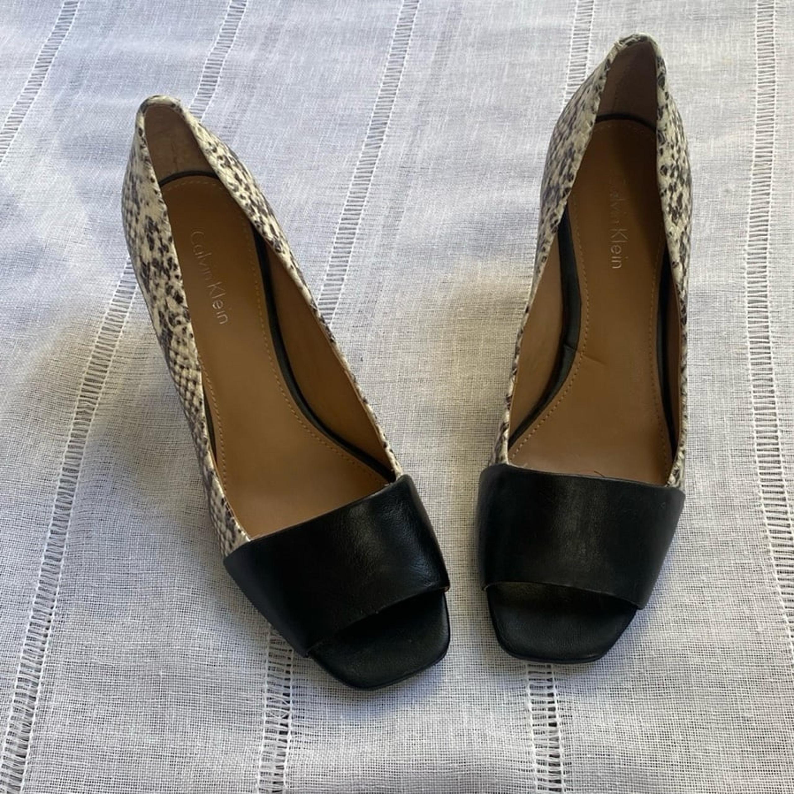 Calvin Klein ‘Nareen’ peep toe pumps with snakeskin print.