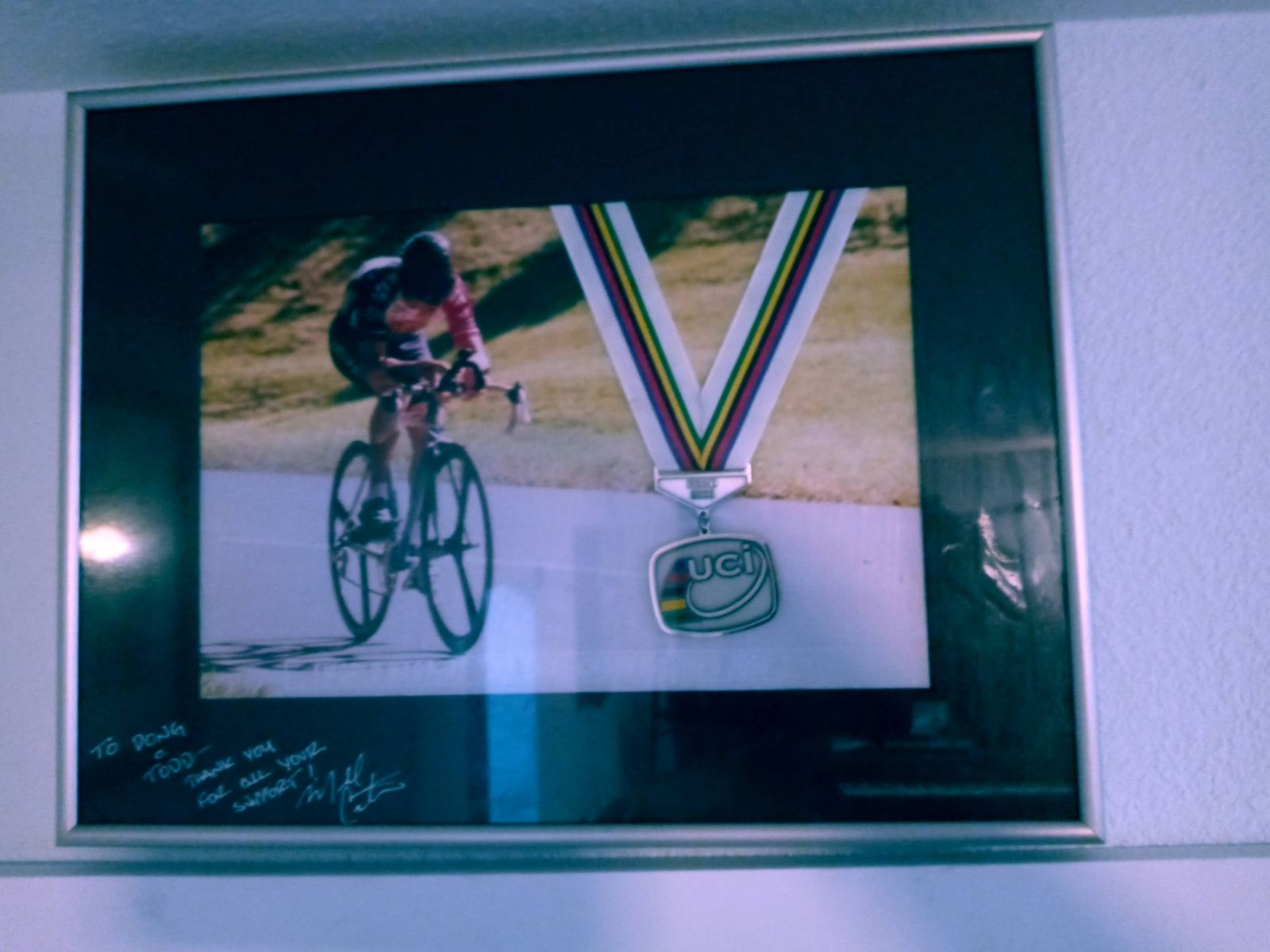 Signed framed photo of a bicycle racer