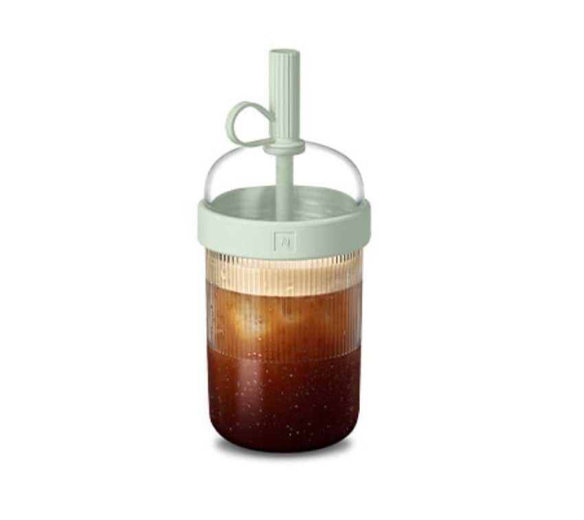 Nespresso Nomad green tumbler.