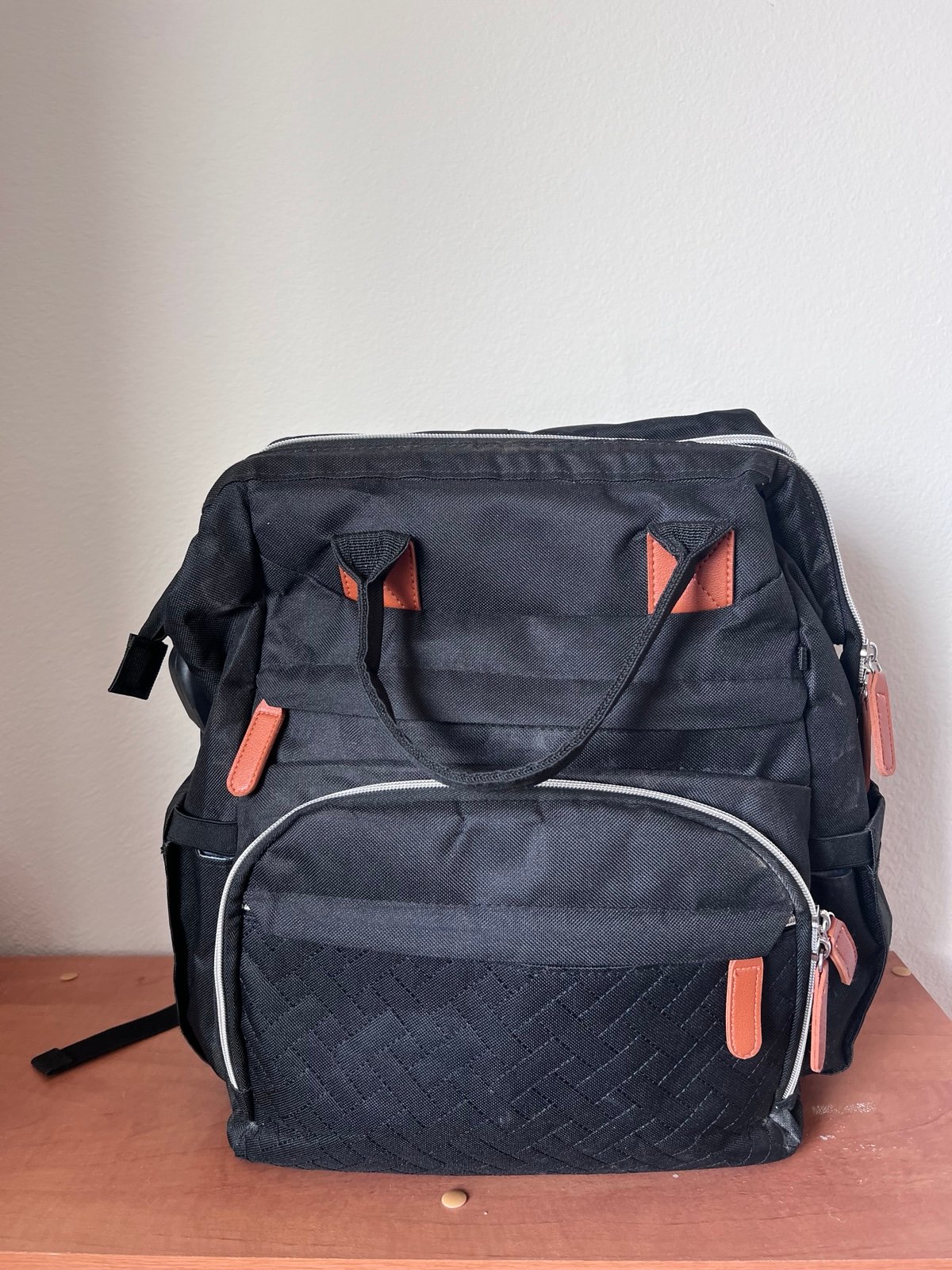 Diaper bag backpack with changing pad