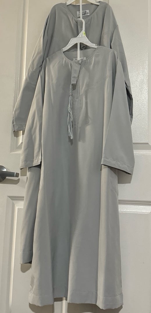 Thobes for young men Five in total, two pair of shoes and two keffiyeh