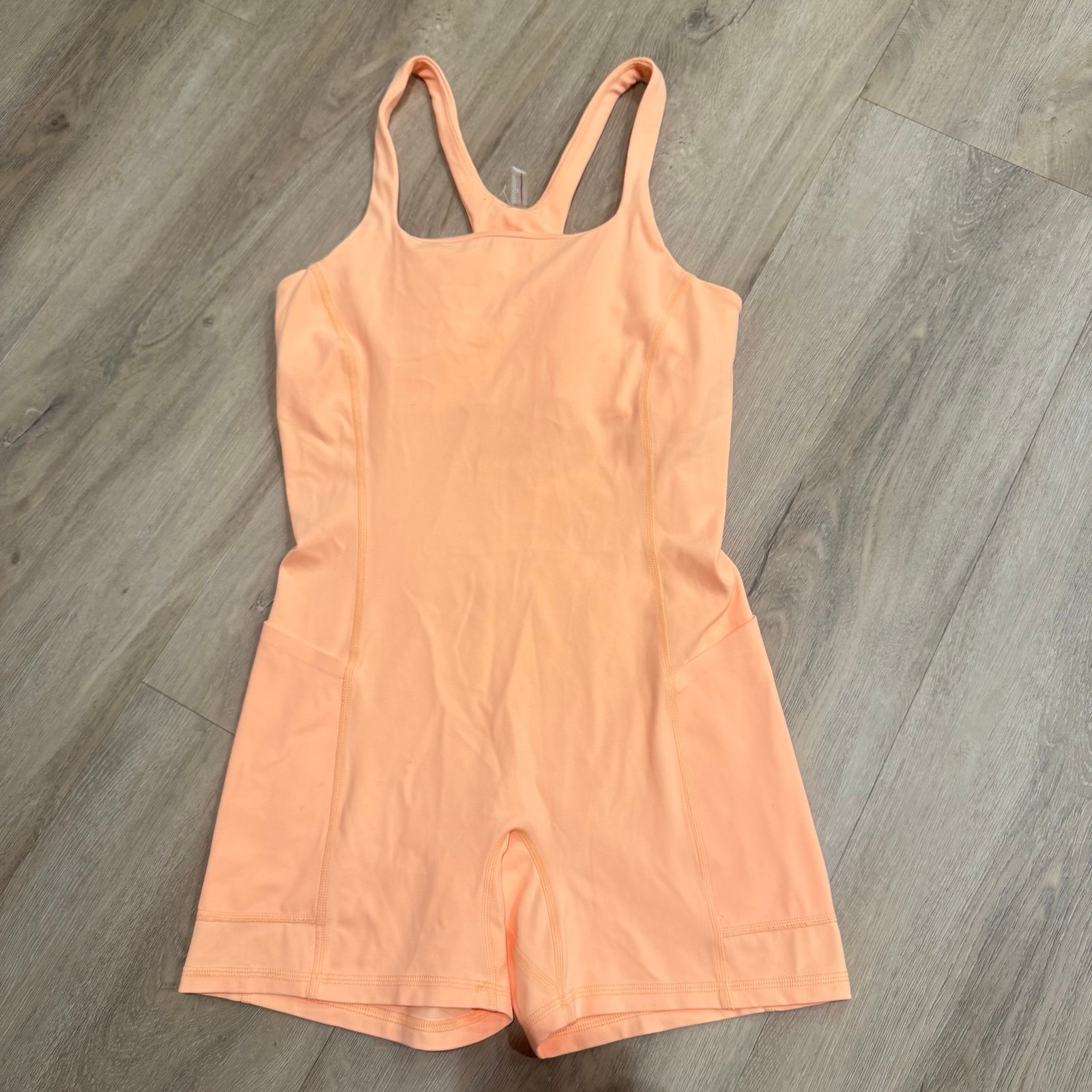 FP Movement Never Better Runsie Bodysuit Peach Orange Racerback Athletic Gym L