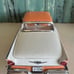 Sun Star 1957 Ford Fairlane 500 Skyliner 1:18 Diecast Model Car Coral/White