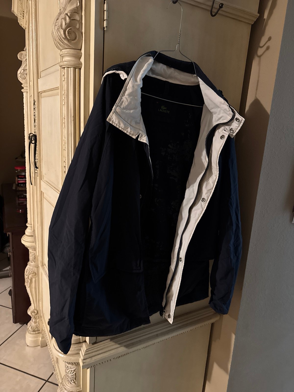 Navy blue LaCoste Brand Jacket with hoodie and side /front pockets size large