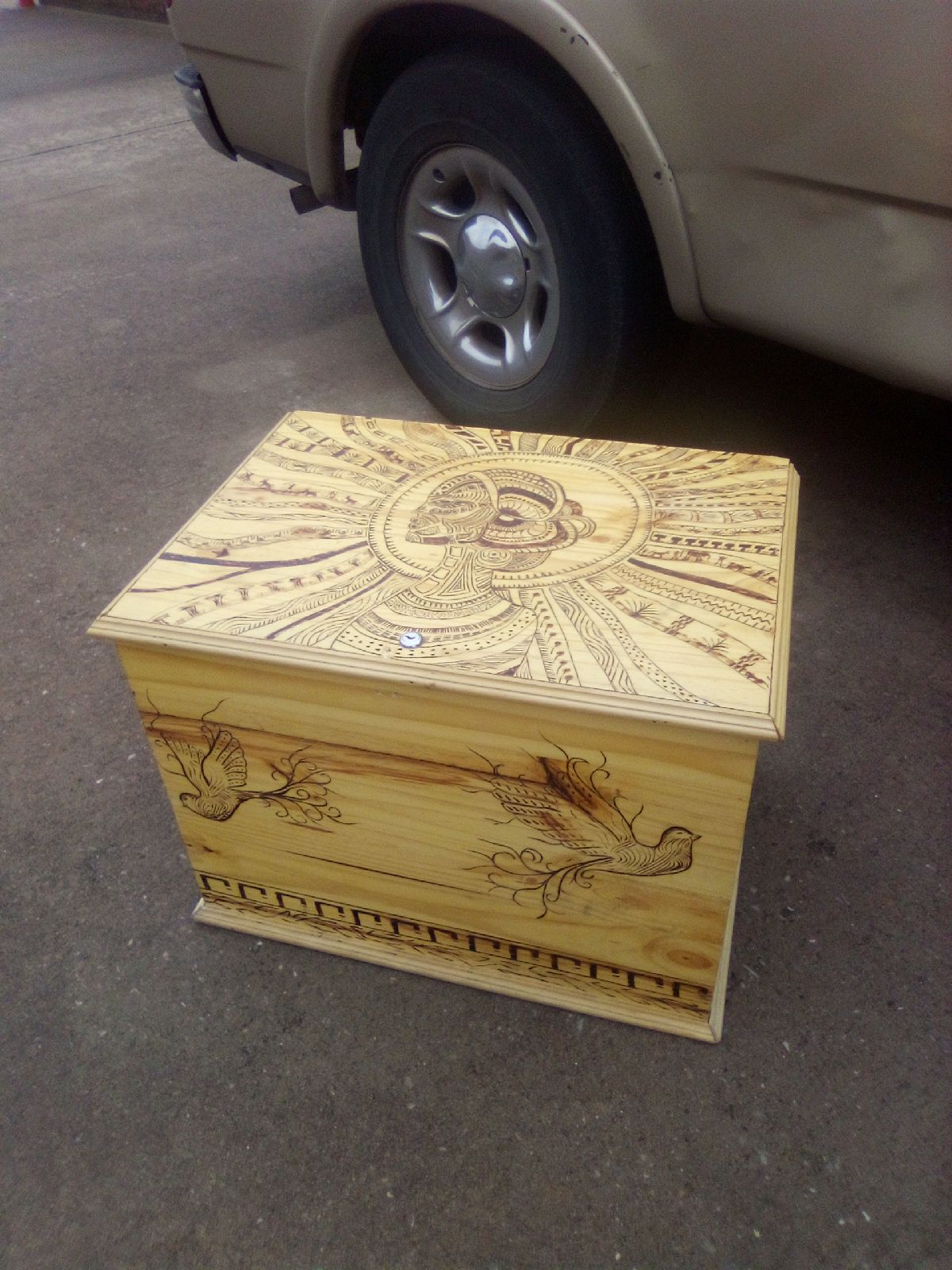 Wooden trunk homemade with burned in drawings
