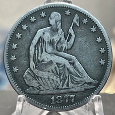 Silver 1877 Seated Liberty Half Dollar.