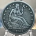 Silver 1877 Seated Liberty Half Dollar.