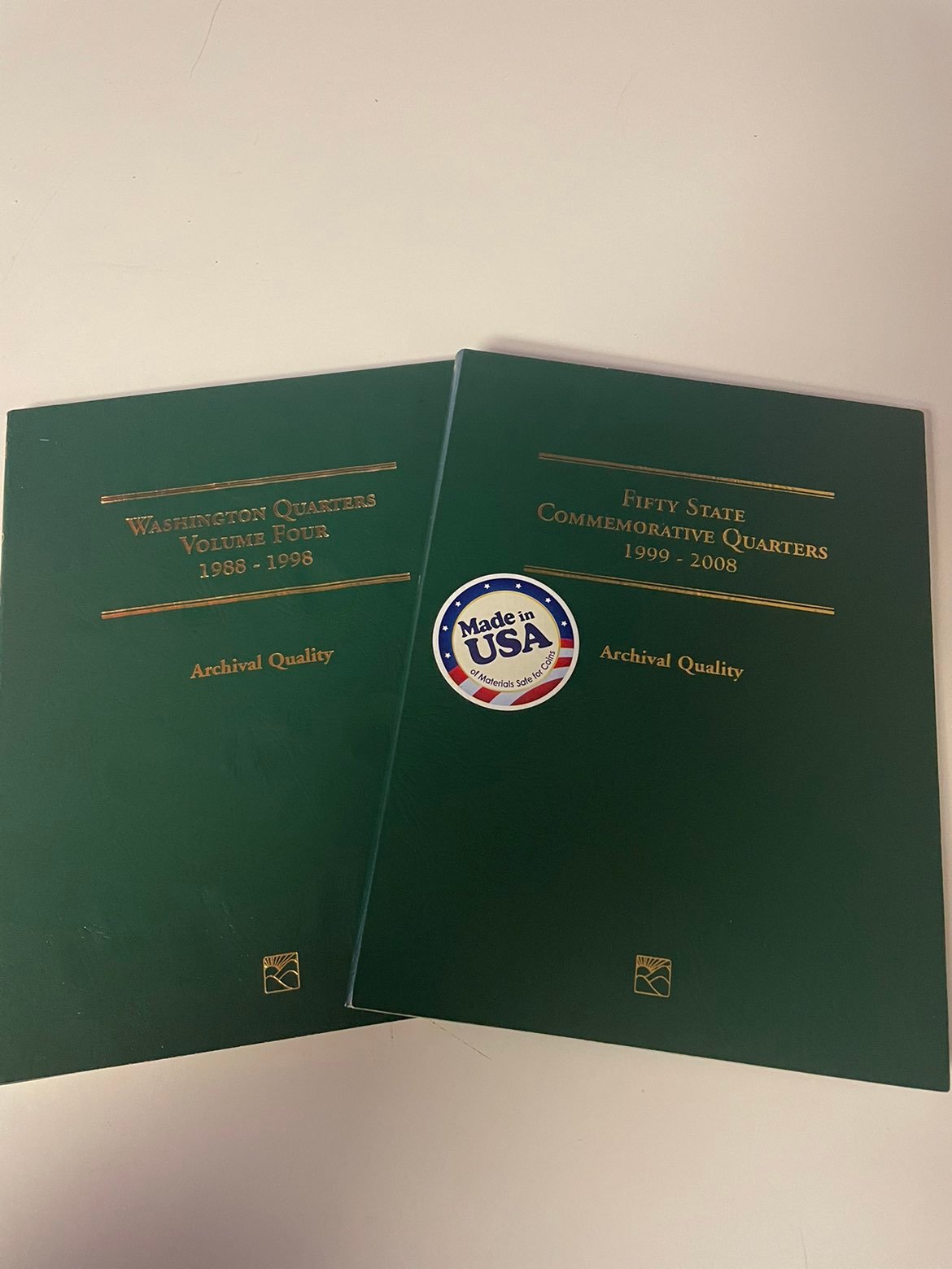 Two folder quarter sets