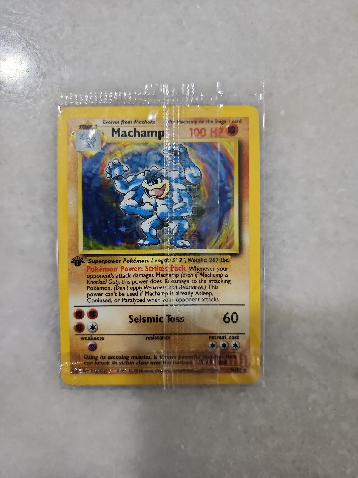 Pokemon Machamp Base Set 1st Edition revised with Shadowed Borders sealed