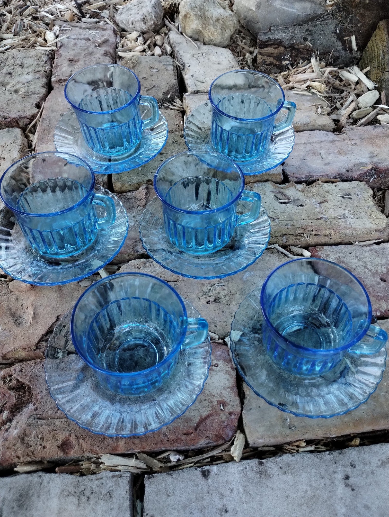Glass tea cups and saucers