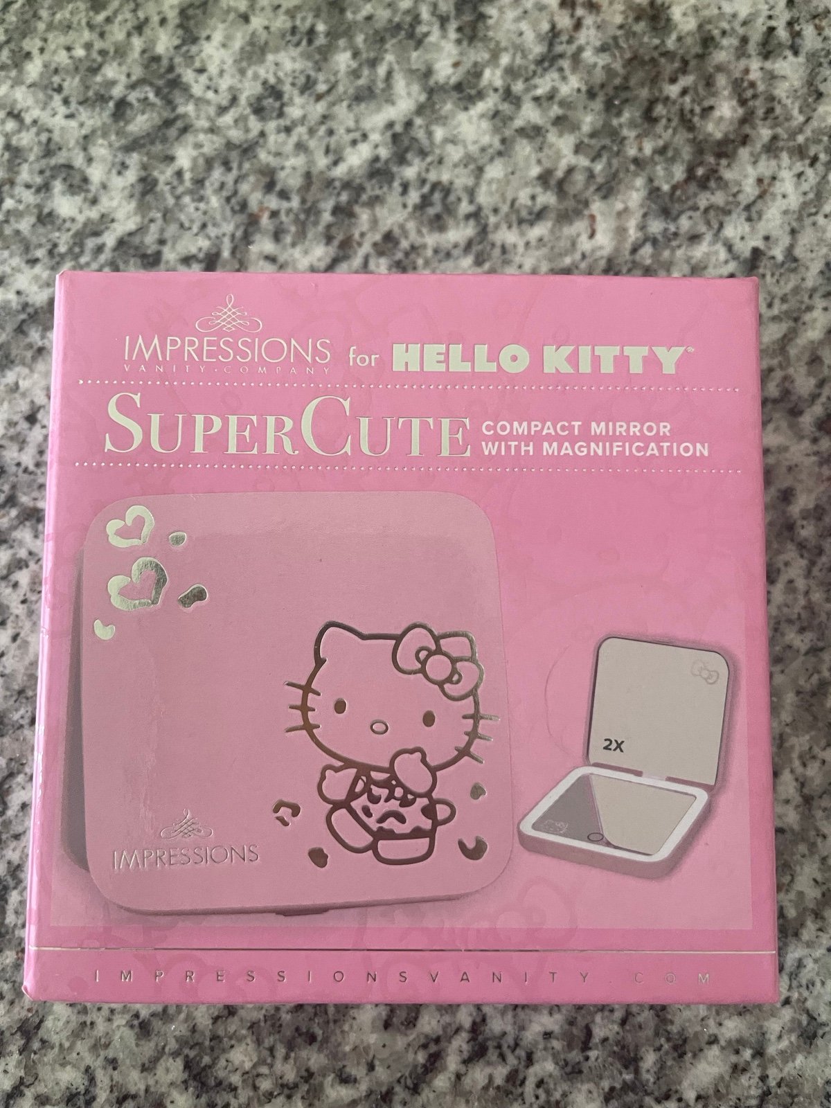 IMPRESSIONS FOR HELLO KITTY COMPACT MIRROR WITH MAGNIFICATION.