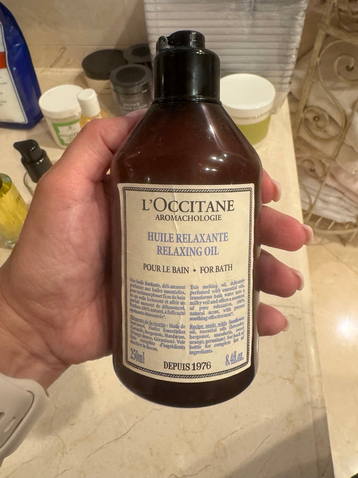 L’Occitane Relaxing Oil for bath 8.4 Fl oz 3/4 full
