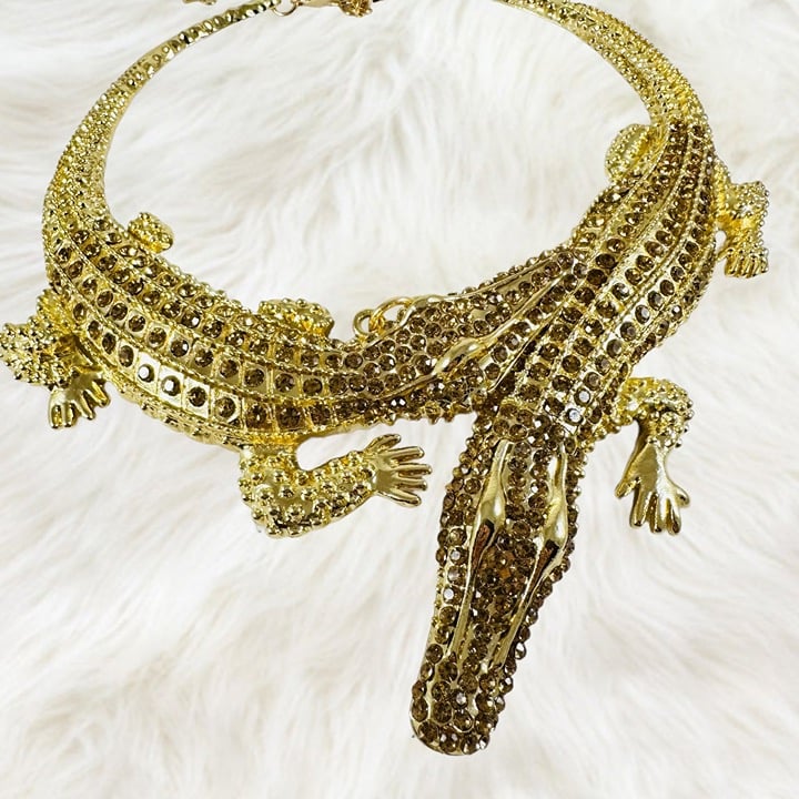 2 cuddling Crocodiles necklace in gold-tone with rich brown rhinestones.
