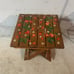 Handmade wooden footrest or potstand.