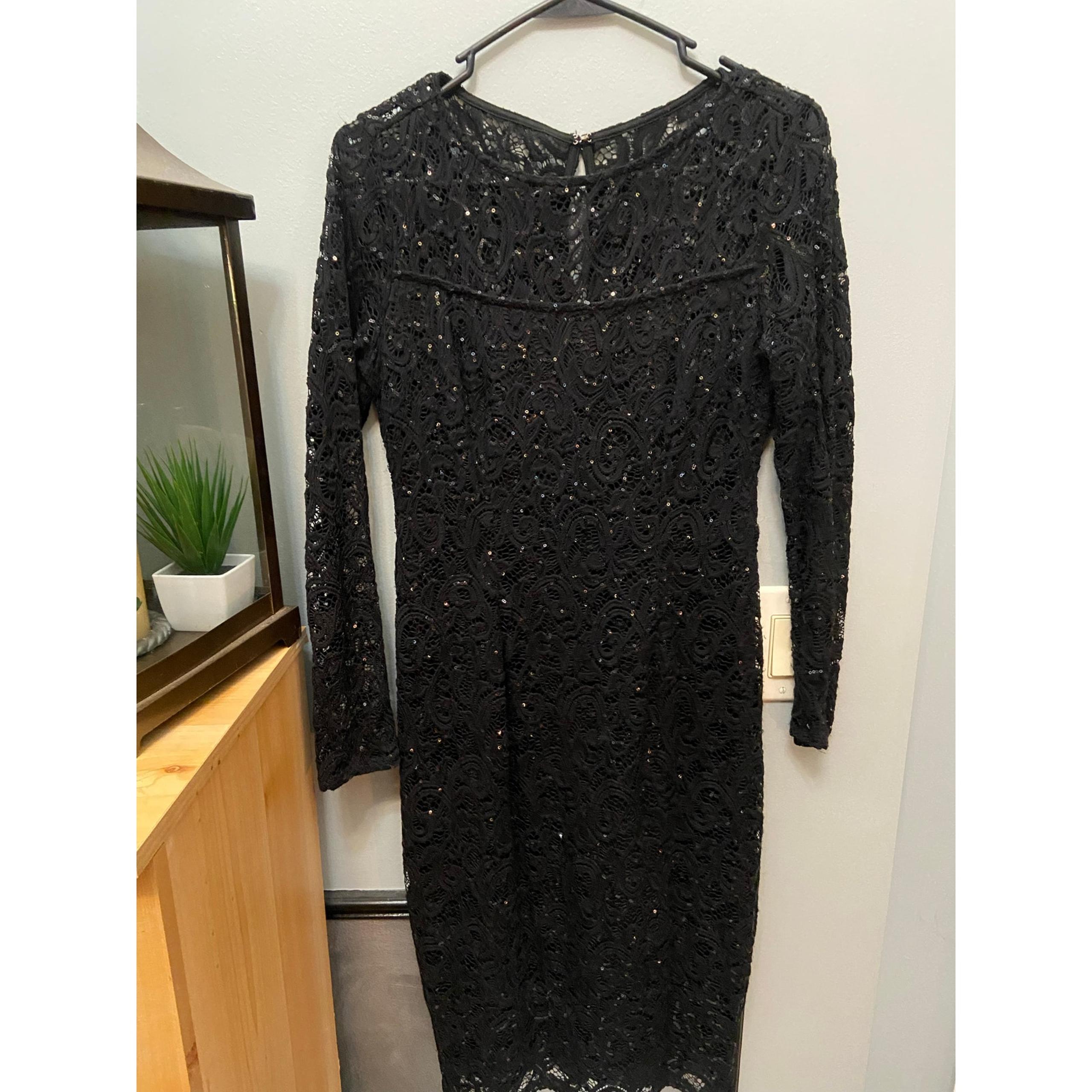 Marina women’s black knee length long sleeved lined dress size 6