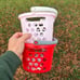 Target toy shopping baskets in red and pink in hand