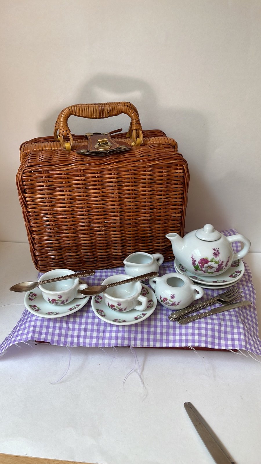 China tea set for pretend play with tablecloth and wicker picnic basket