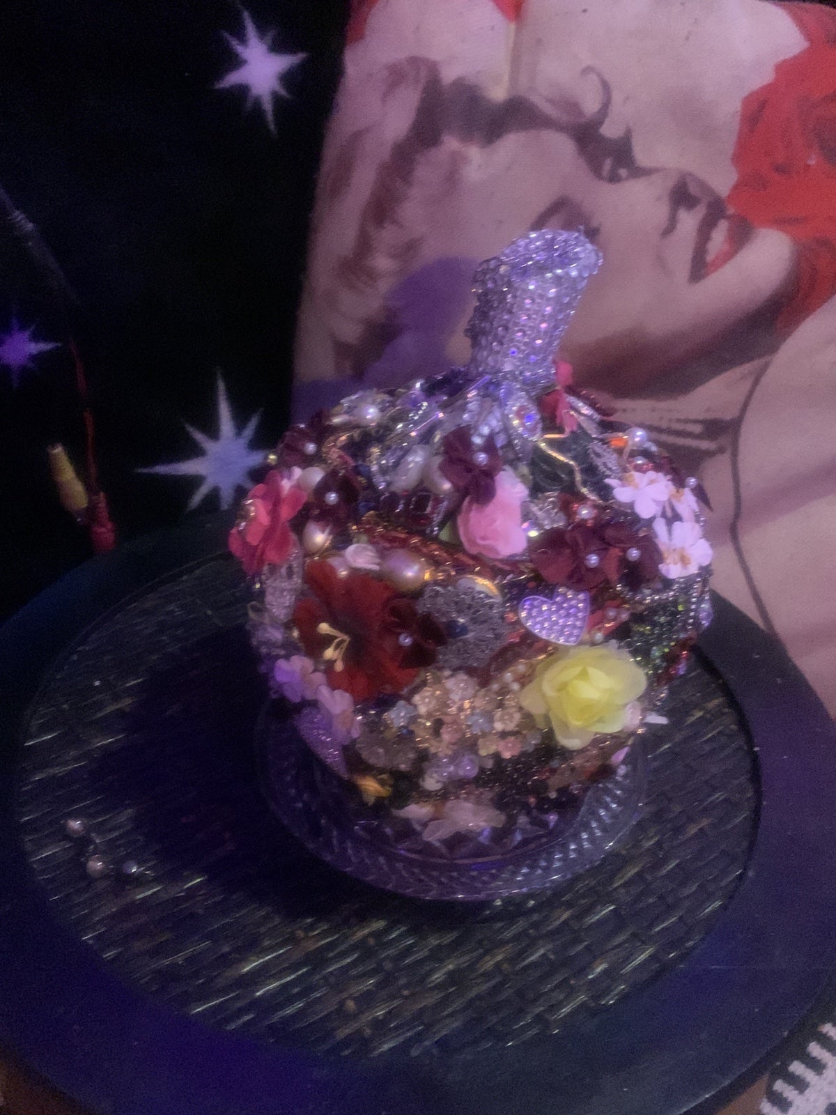 Handmade costume jewelry encrusted apple statue.