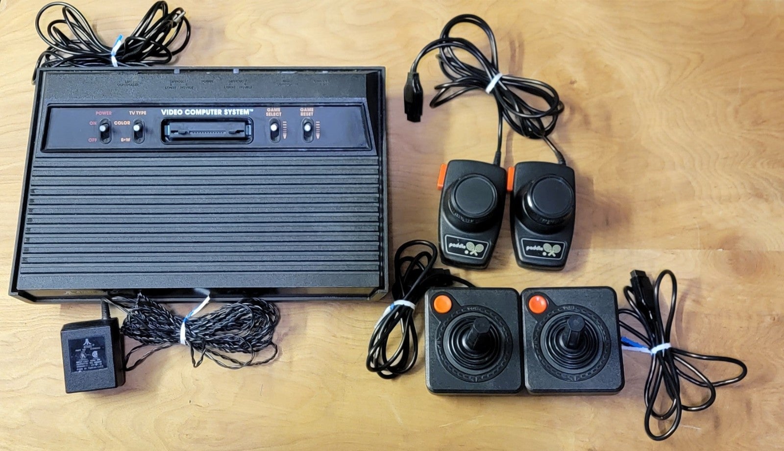 Vintage Original ATARI 2600 console with power cord, 2 joysticks & 2 paddles