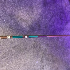 green and brown pool cue