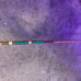 green and brown pool cue