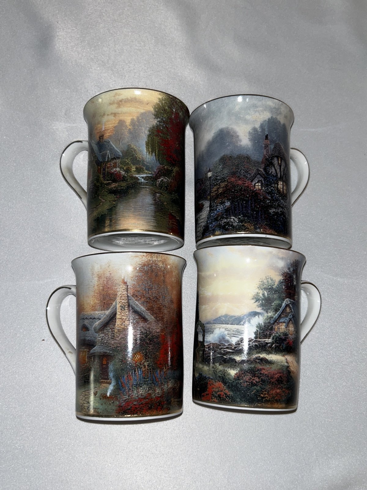 Thomas Kinkade 4 coffee mugs made in 2002.