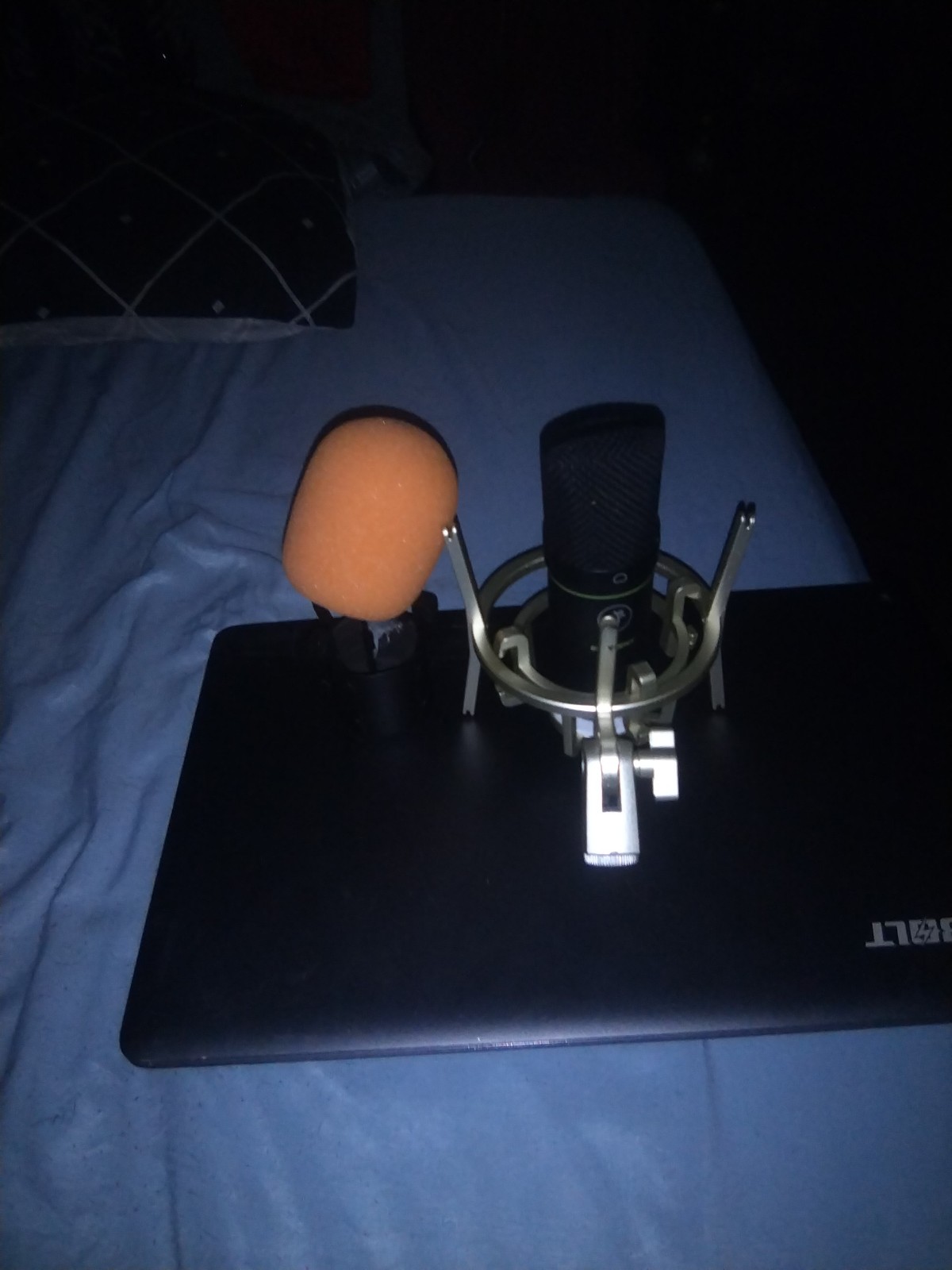Microphone 2 shock mounts and wind screen and a gaming laptop