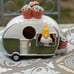 Super cute gareden gnome in camper bright and colorful birdhouse