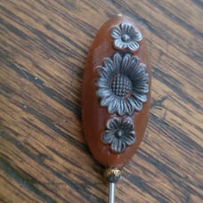 Vintage bakelite hat pin with flowers