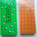 Brand new shogi board and beautiful shogi pieces (made of plastic).