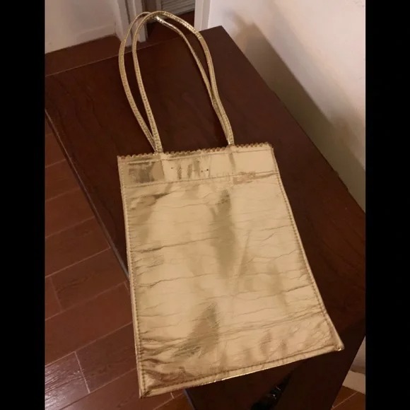 Gold purse snap closure paper bag style 9x 7 inches approximately without handle