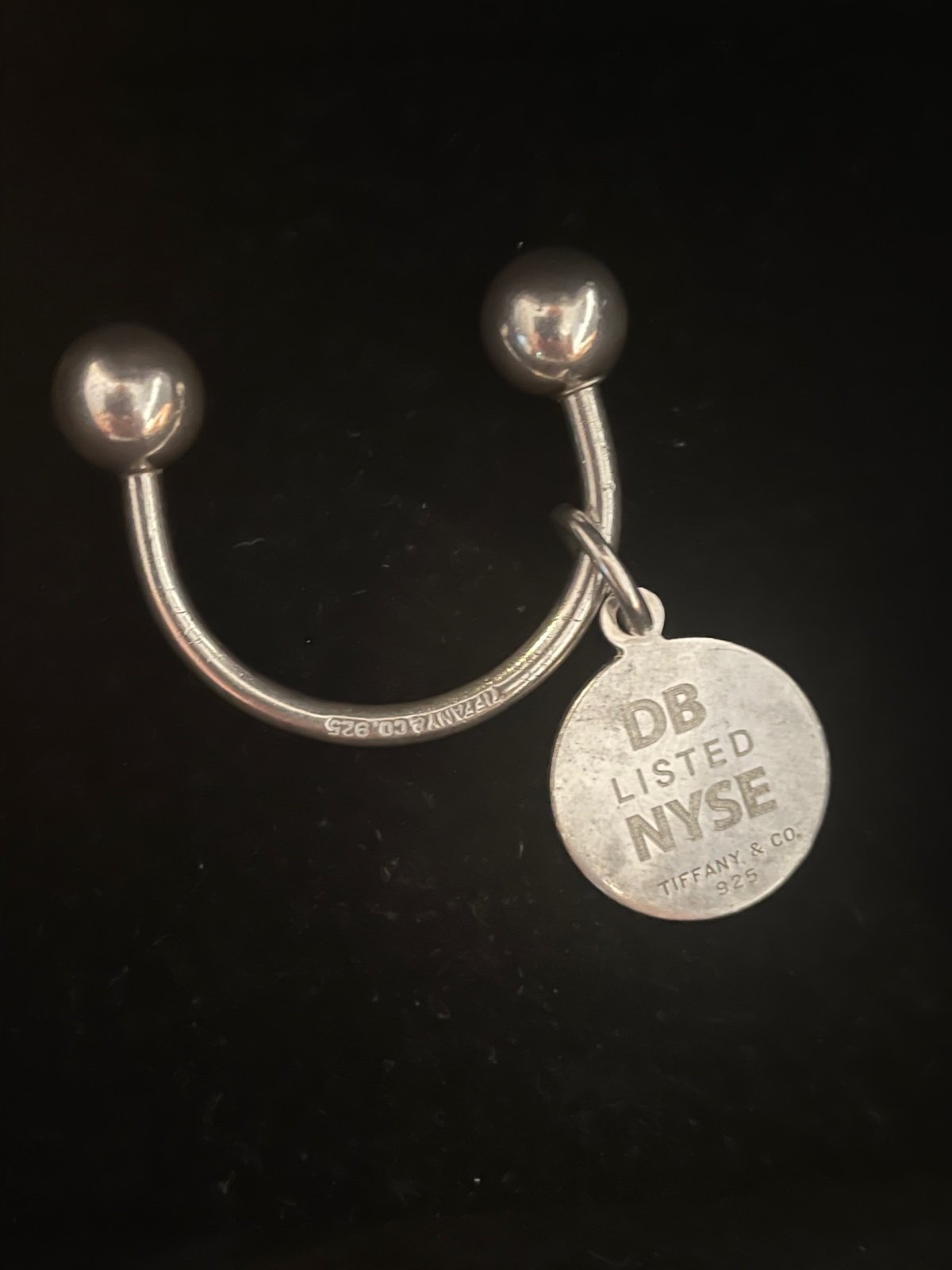 Tiffany &co. Keychain with round pendant sterling sliver. weight 10.1 grams