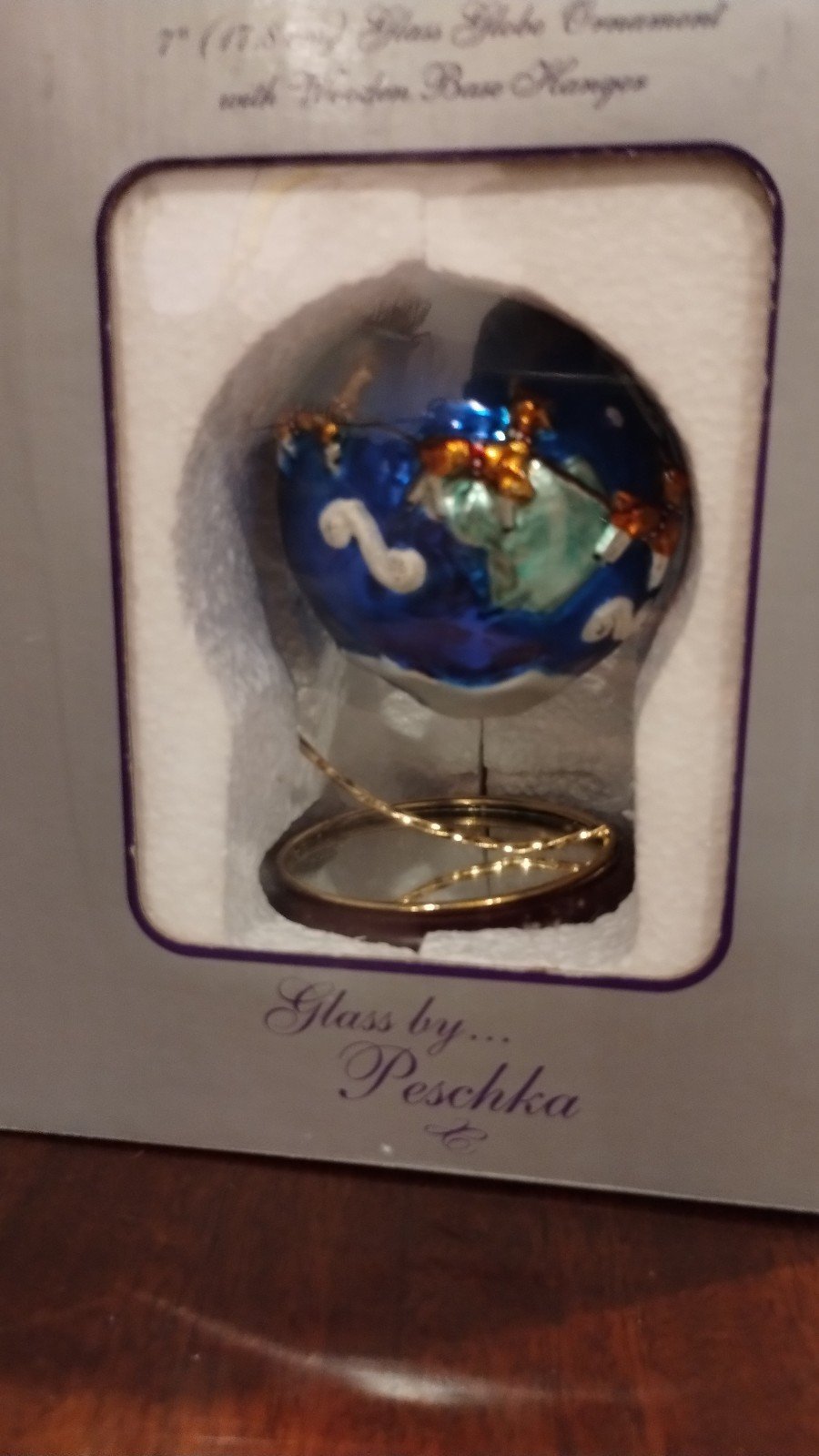 Glass earth with Santa clause and reindeer flying around it ornament by Peschka