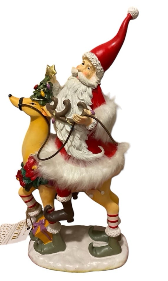 Christmas North Pole South Santa Claus Riding a Reindeer 2023 Collectible.