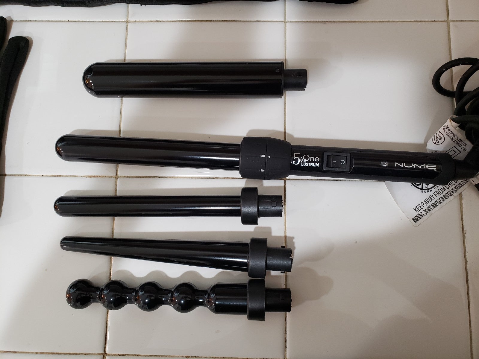 Nume 5 in one curling iron .