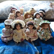 12 collectable porcelain Girl Doll's.
