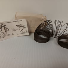 Slinky Jr. in the original shipped (damaged) box with instruction card