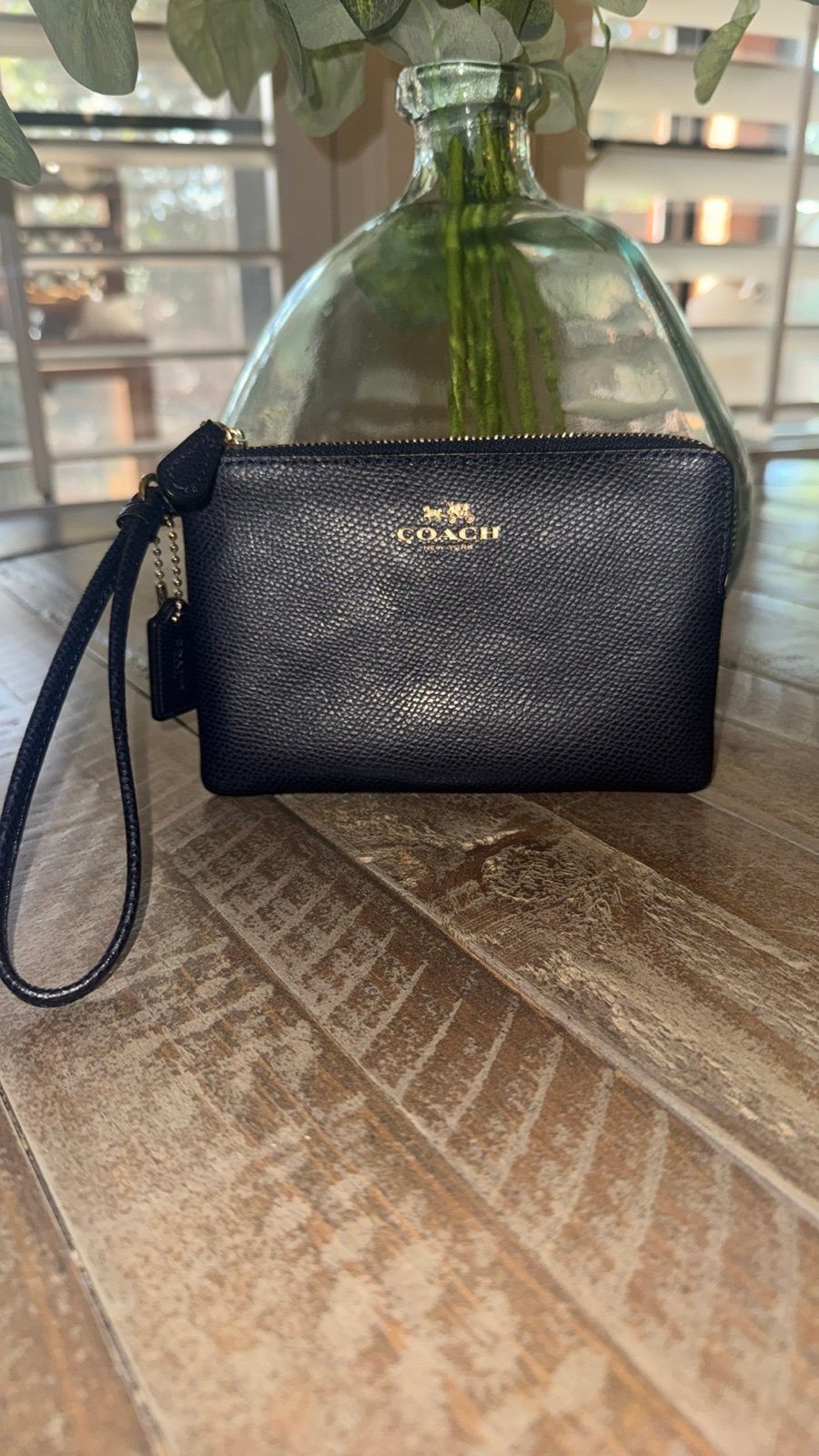 Like New, Coach navy corner wristlet.