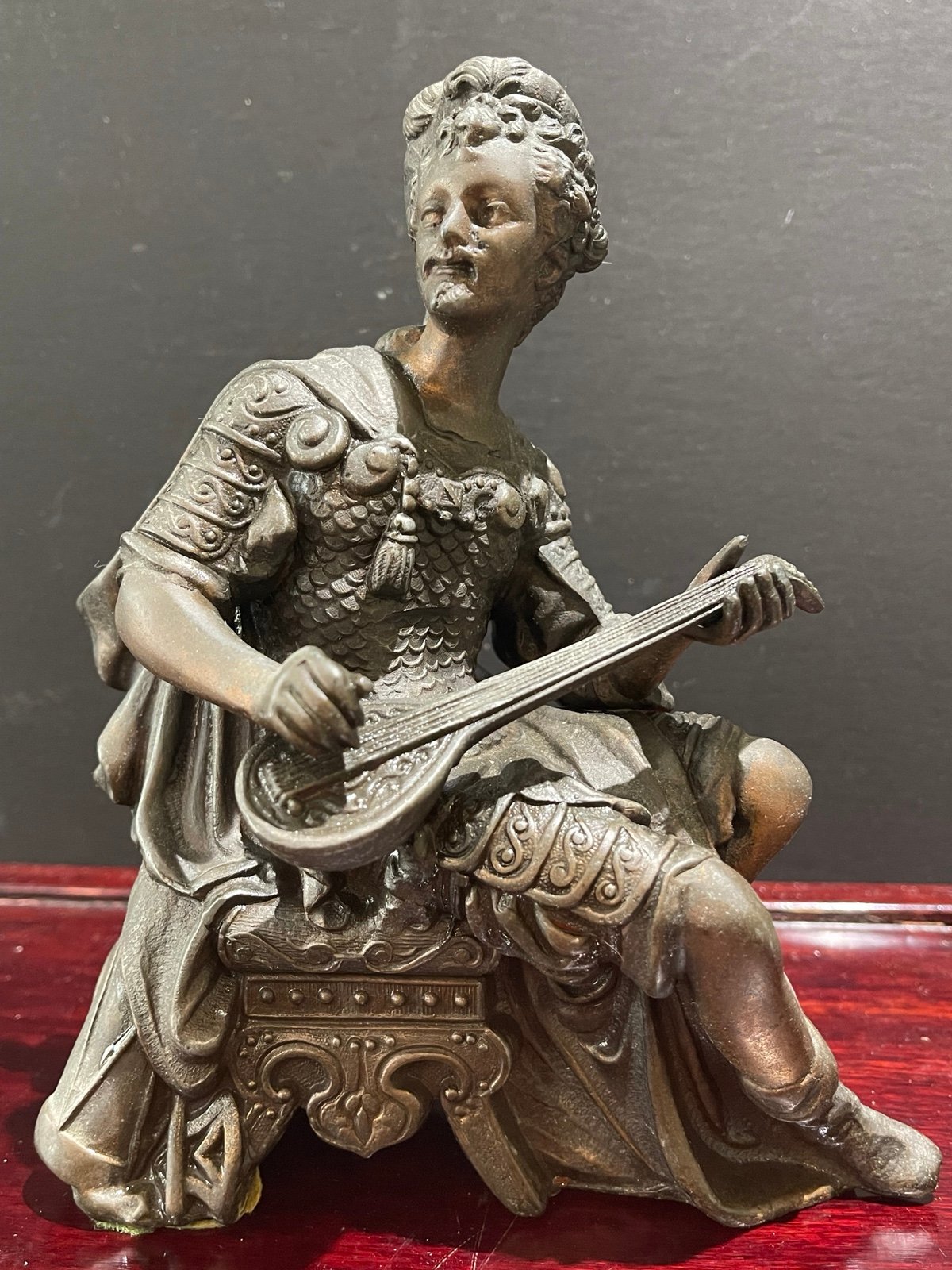 Antique French cast metal Statue of men playing lute.