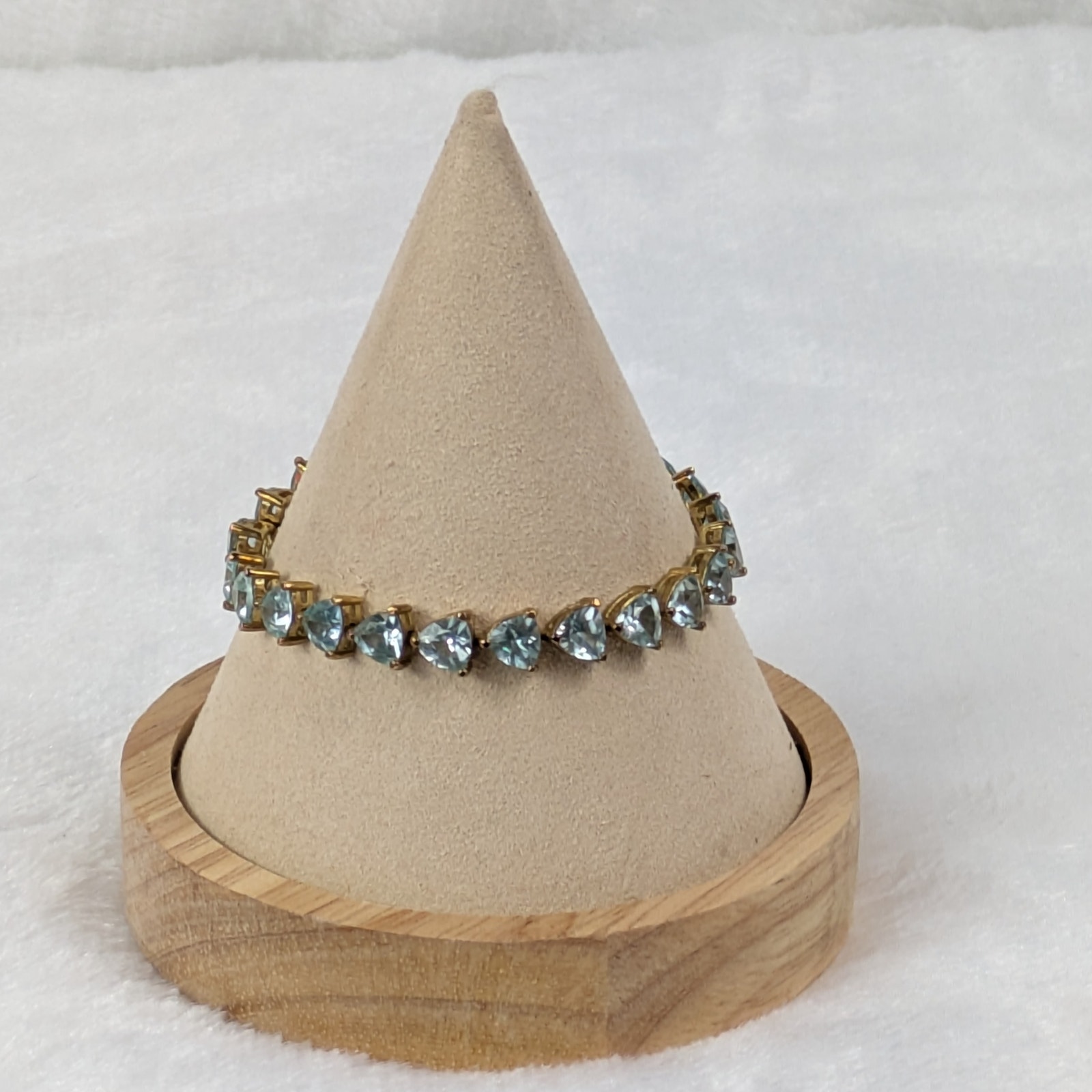 UCI Gold Tone Tennis Bracelet 7 Simulated Aquamarine Trillion Cut Stones
