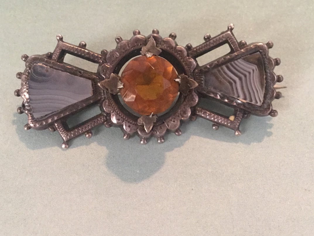 Antique silver agate and probably citrine stone with fancy prongs
