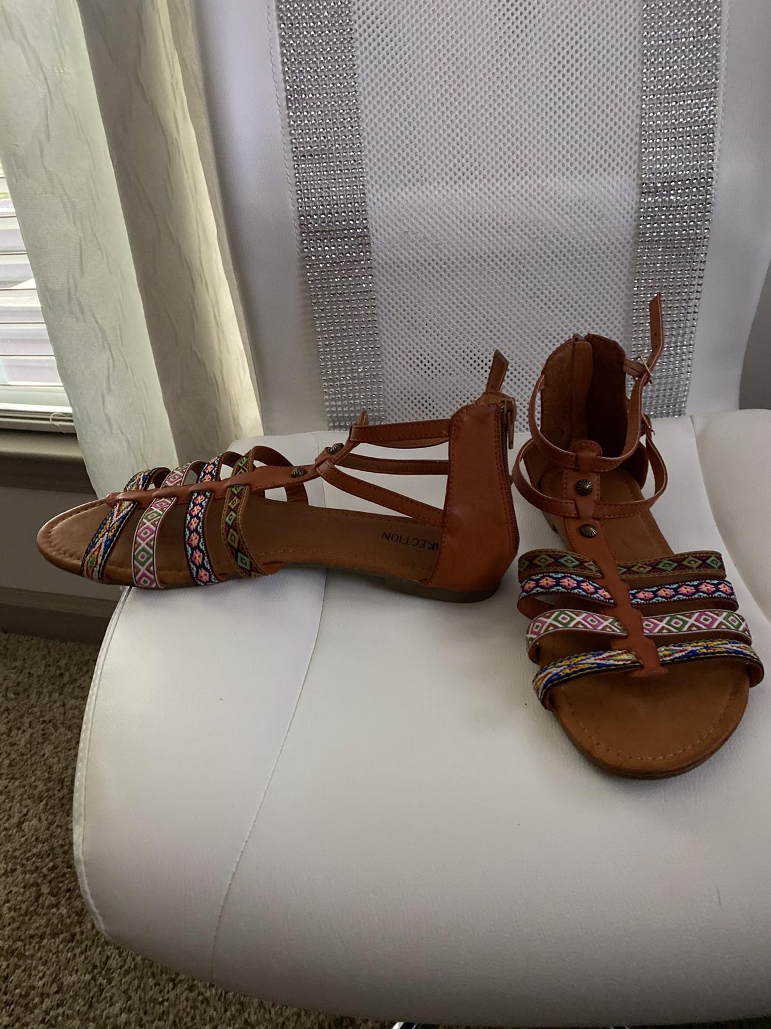 Brown and Aztec patterned sandals